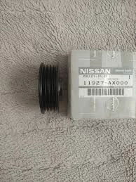 Nissan 11927AX000 Натяжной ролик приводного ремня 11927-AX000: 1 ...
