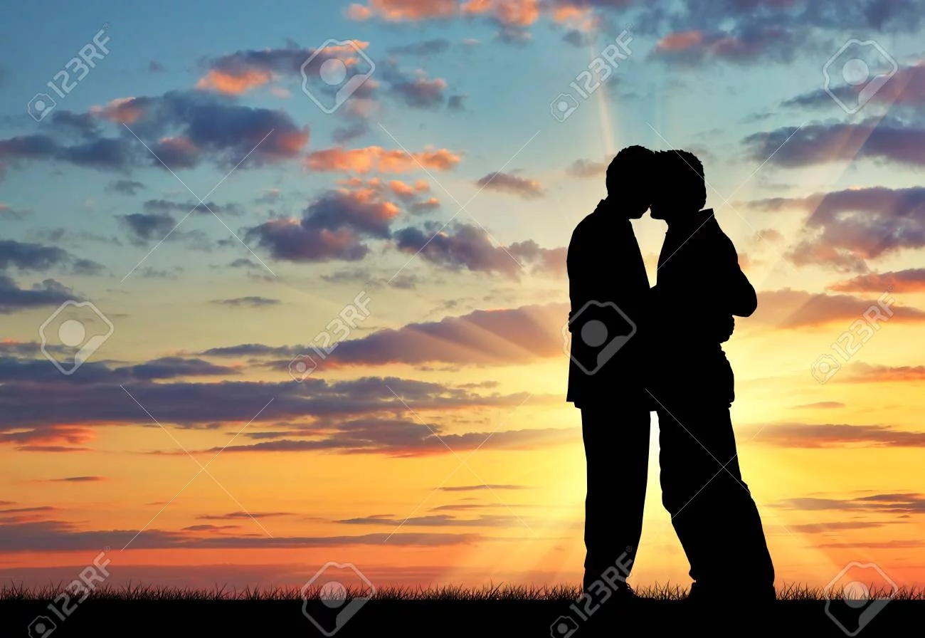 933903-silhouette-of-two-gay-men-kissing-at-sunset.webp