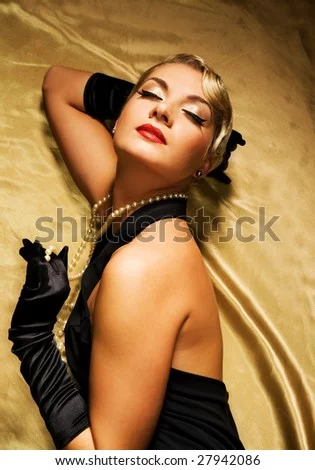 ely-woman-on-golden-fabric-retro-portrait-27942086.webp