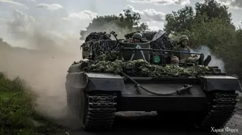 Reuters ukrainian troops ride in a tank in sumy region near the Russian border