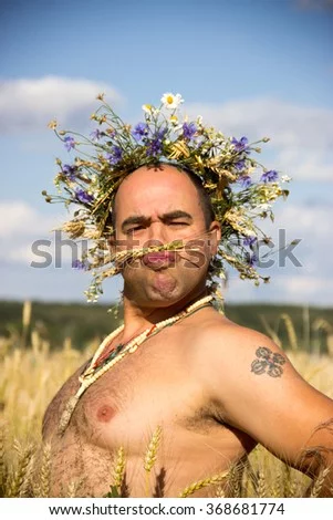 -flowers-on-the-head-standing-in-a-wheat-368681774.webp