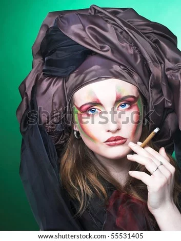 n-with-creative-make-up-smoking-cigarette-55531405.webp