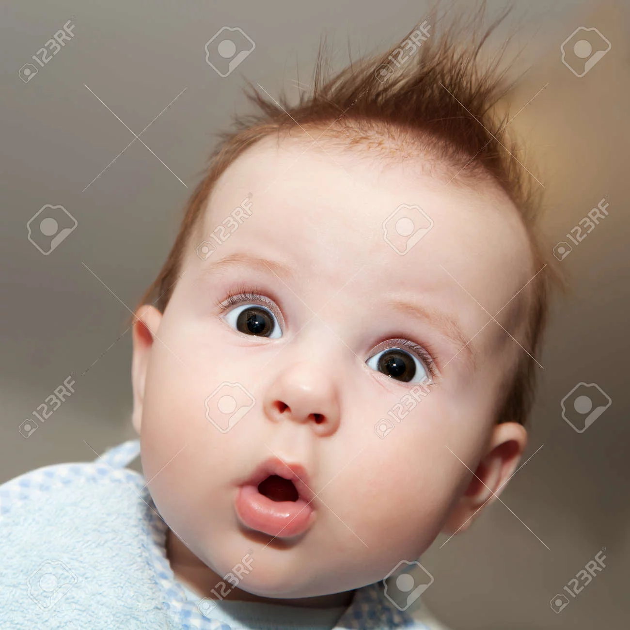old-baby-making-a-funny-surprised-face-Stock-Photo.webp