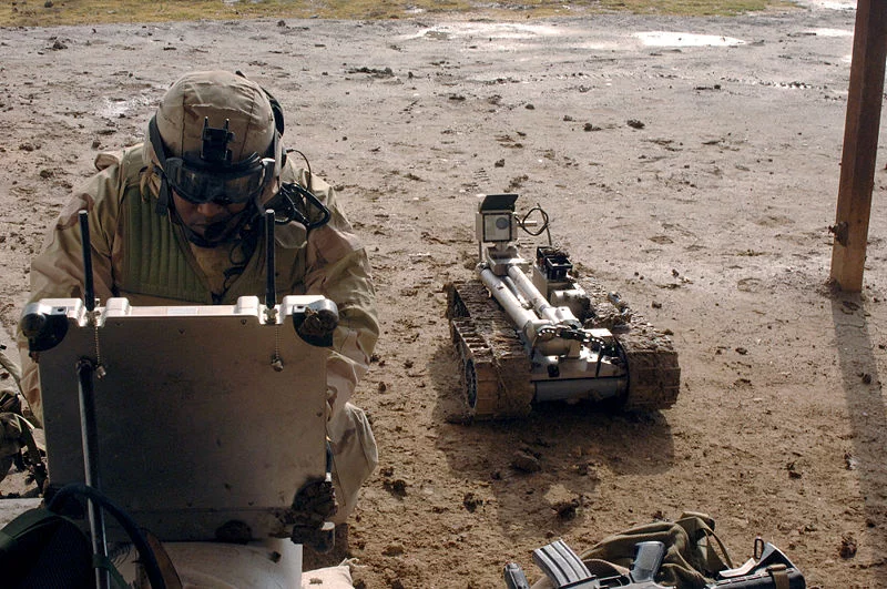 px-Military_robot_being_prepared_to_inspect_a_bomb.webp
