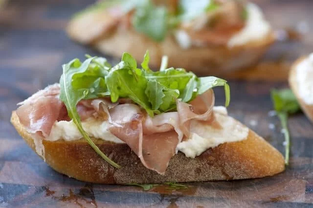 rosciutto-and-Ricotta-Crostini-with-Honey-Recipe-1.webp