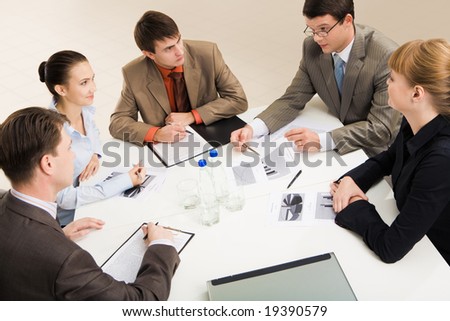 stions-gathered-together-around-the-table-19390579.jpg