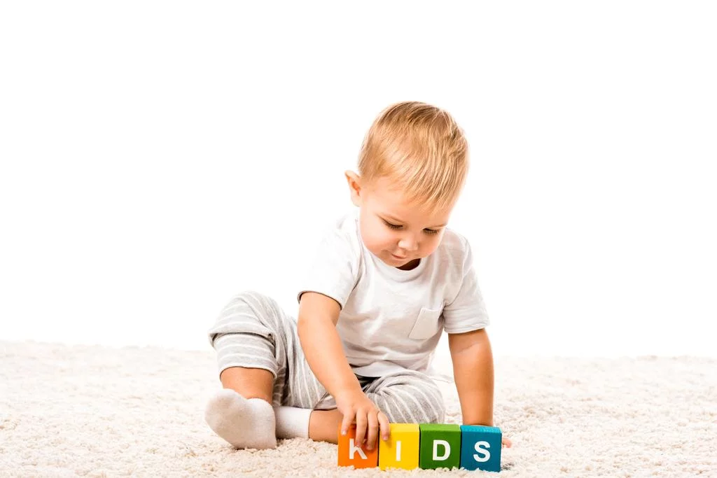 stock-photo-cute-toddler-boy-playing-colored.webp