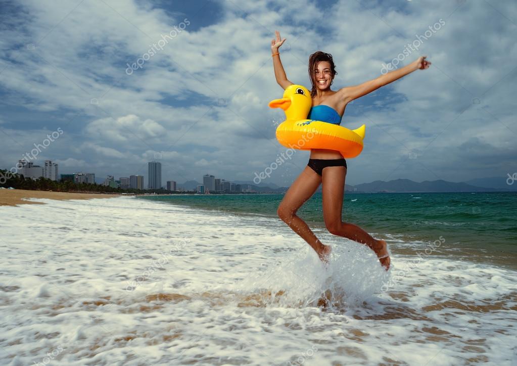 tos_80366580-stock-photo-girl-with-yellow-lifebuoy.jpg