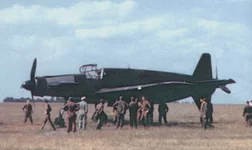 DO-335 showing its massive size compared to people gathered around it.webp