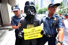 policemen-push-away-dark-vade.webp