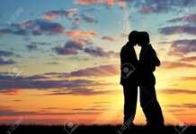 933903-silhouette-of-two-gay-men-kissing-at-sunset.jpg