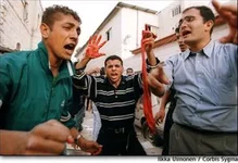 waves-entrails-of-butchered-Israeli-victims-in-Ramala-390X270.jpg